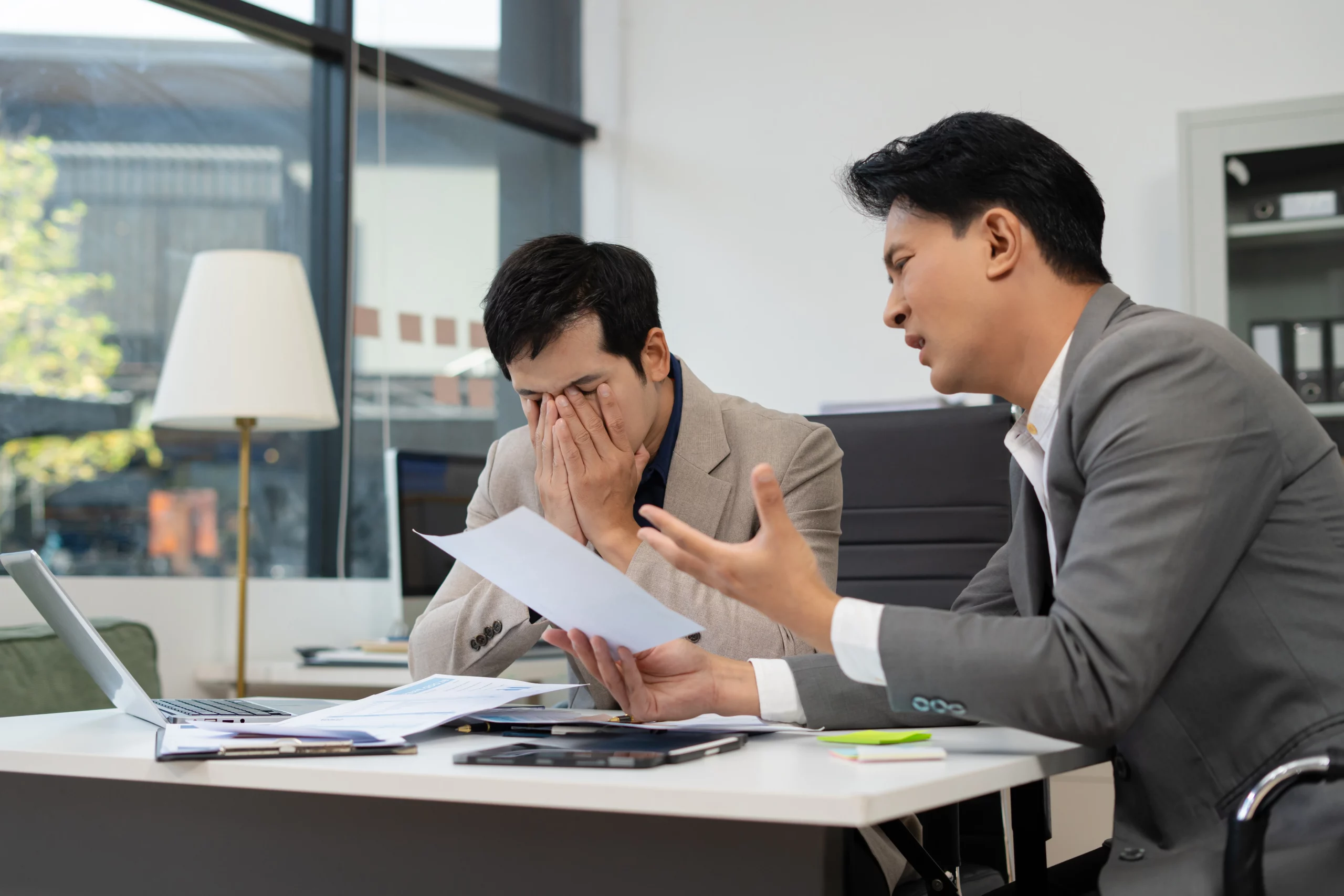 Employee discussing a workplace accommodation request with a manager during an employment dispute in Orange County, California